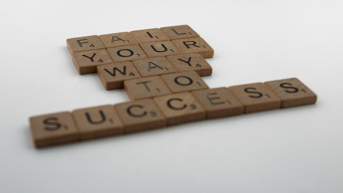 scrabble, scrabble pieces, lettering, letters, wood, scrabble tiles, white background, words, quote, fail your way to success, persevere, don't give up, try again, get up, move on, keep innovating,